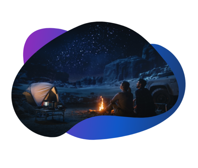 Two campers at a campfire