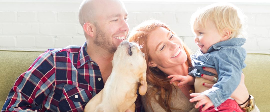 Couple with a son and dog