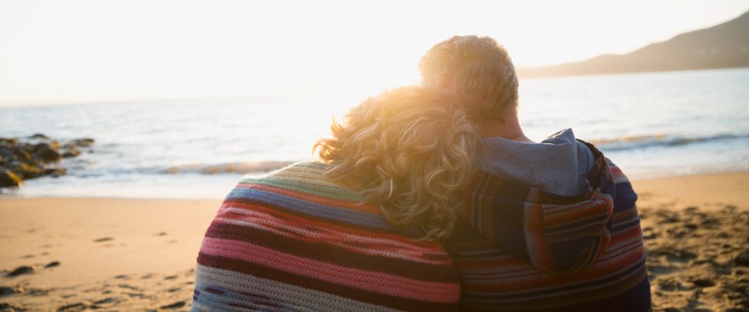 Couple sitting on the beach