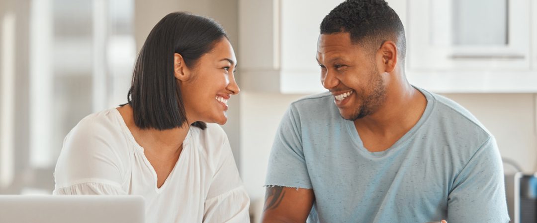 Couple looking at a laptop