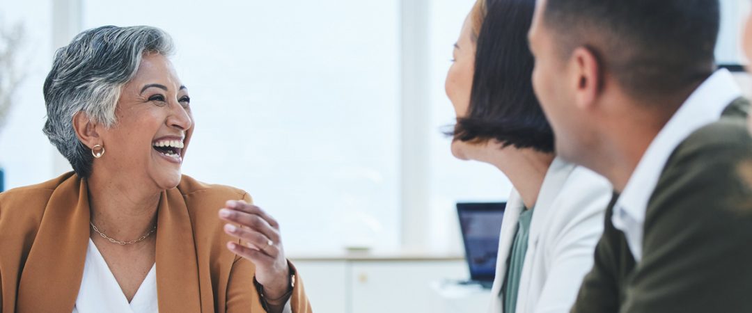 Business woman speaking with two employees