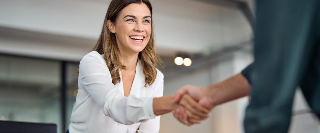 Business woman shaking hands