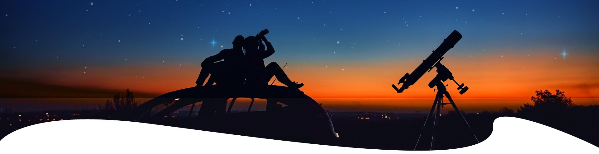 Couple viewing the stars with telescopes