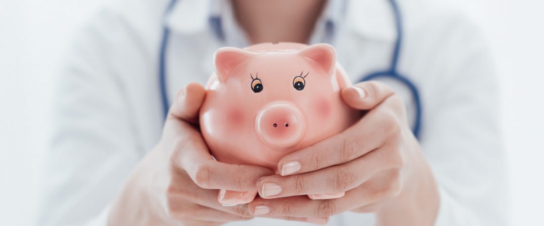 Person holding a piggy bank